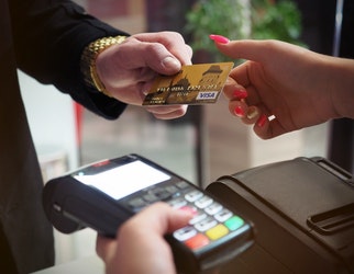 photo of person handing card